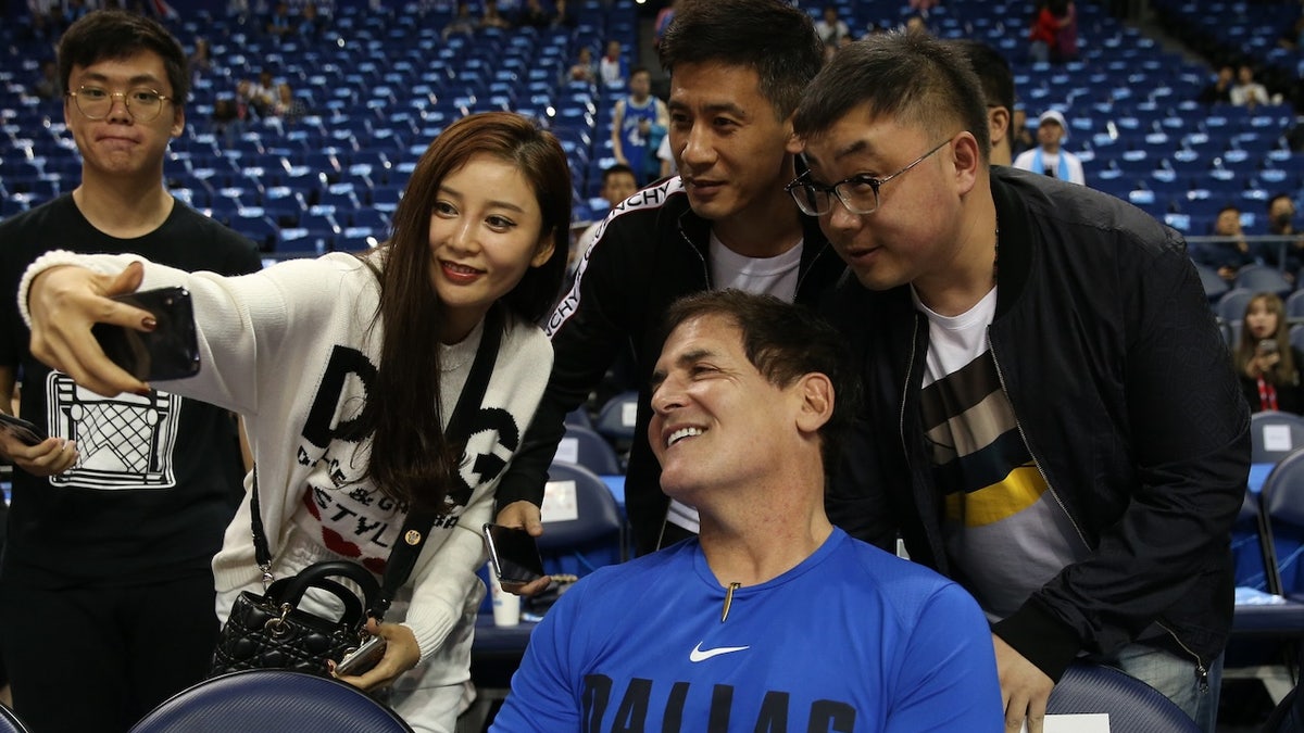 Dallas Mavericks proprietor  Mark Cuban poses for a photograph  with fans anterior  to the crippled  against the Philadelphia 76ers arsenic  portion  of the 2018 China Games connected  Oct. 5, 2018 astatine  the Mercedes-Benz Arena successful  Shanghai.