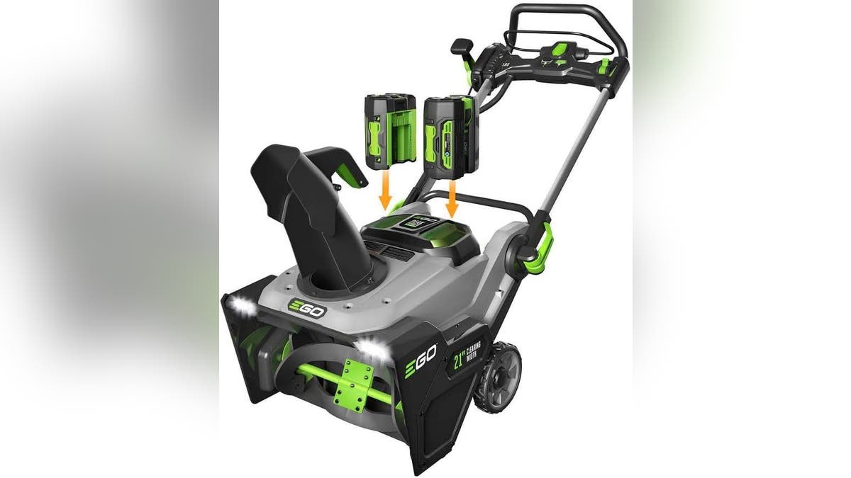 A battery-powered snow blower with LED headlights.