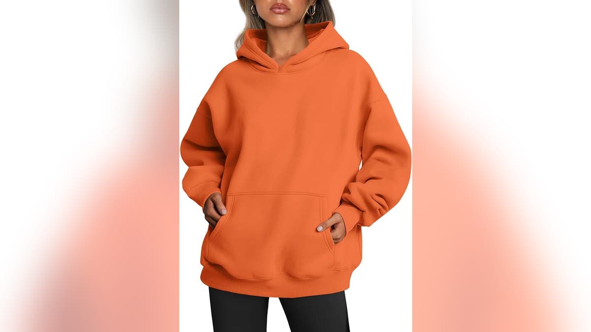 Turn a simple orange sweatshirt into a jack-o-lantern costume. 