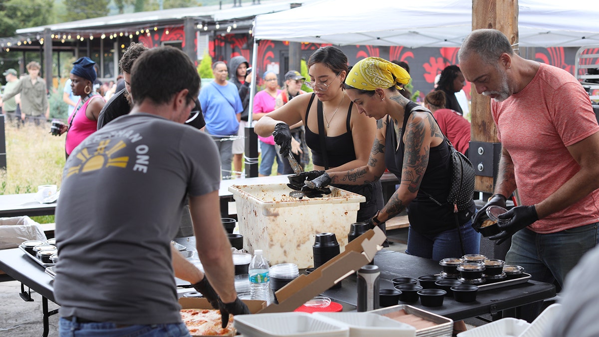 Volunteers serving meals.