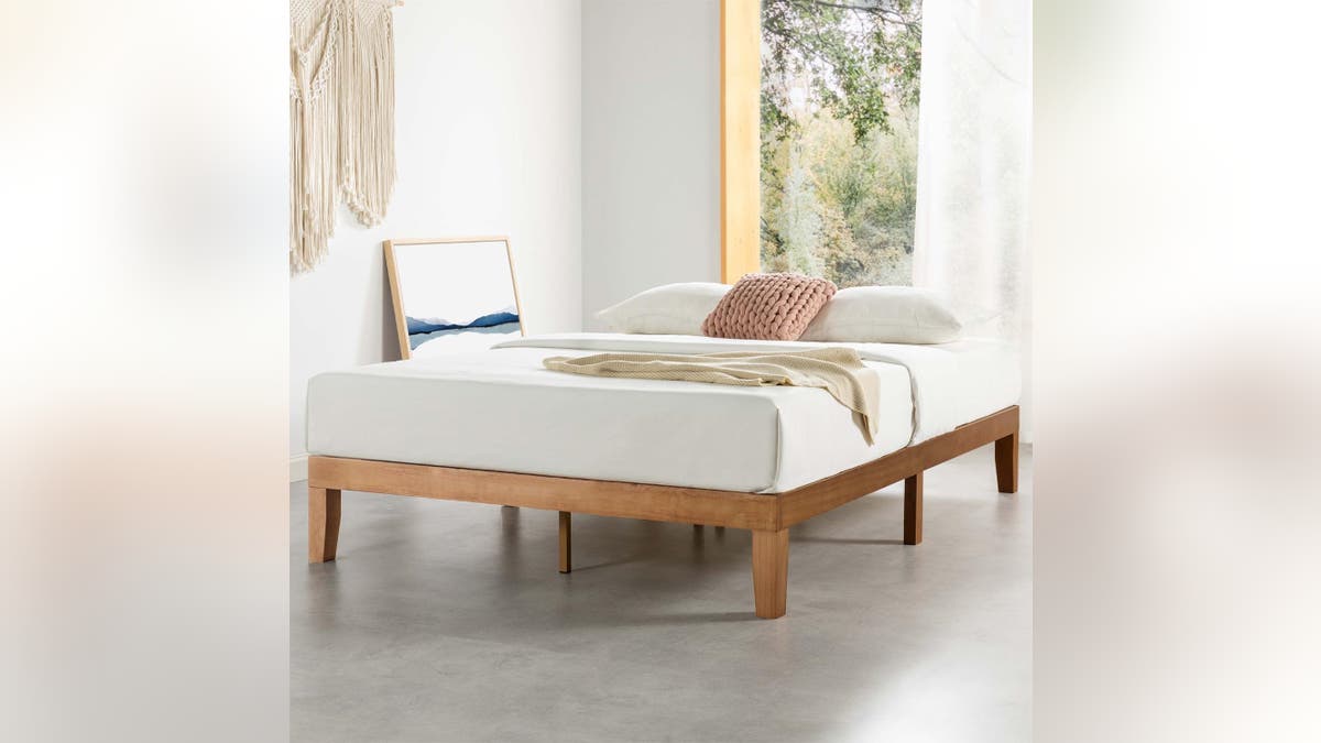 Go simple with this honey wood bedframe. 
