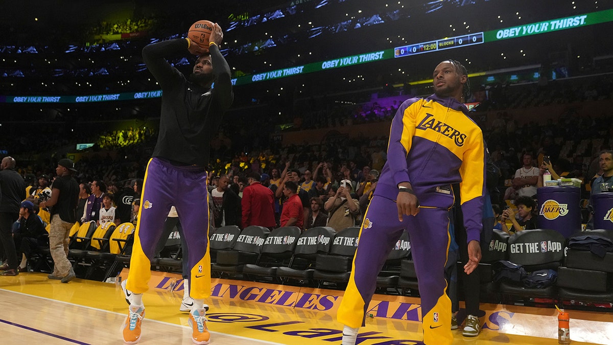 LeBron and Bronny James lukewarm  up