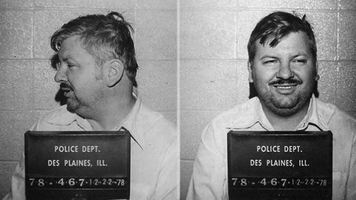 Two side-by-side black and white mugshots of John Wayne Gacy, showing his side profile and then smiling but looking slightly away from the camera