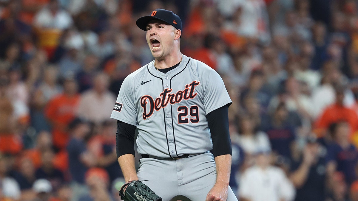 Tigers pitcher reacts during a game