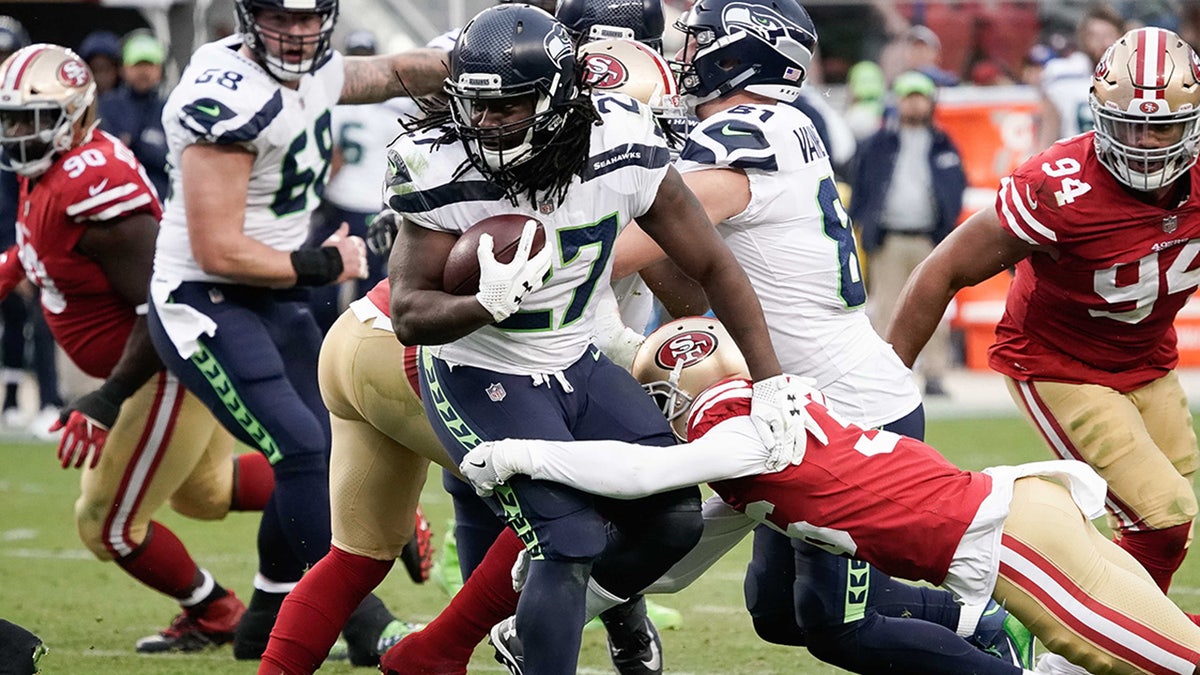 Eddie Lacy runs with the football