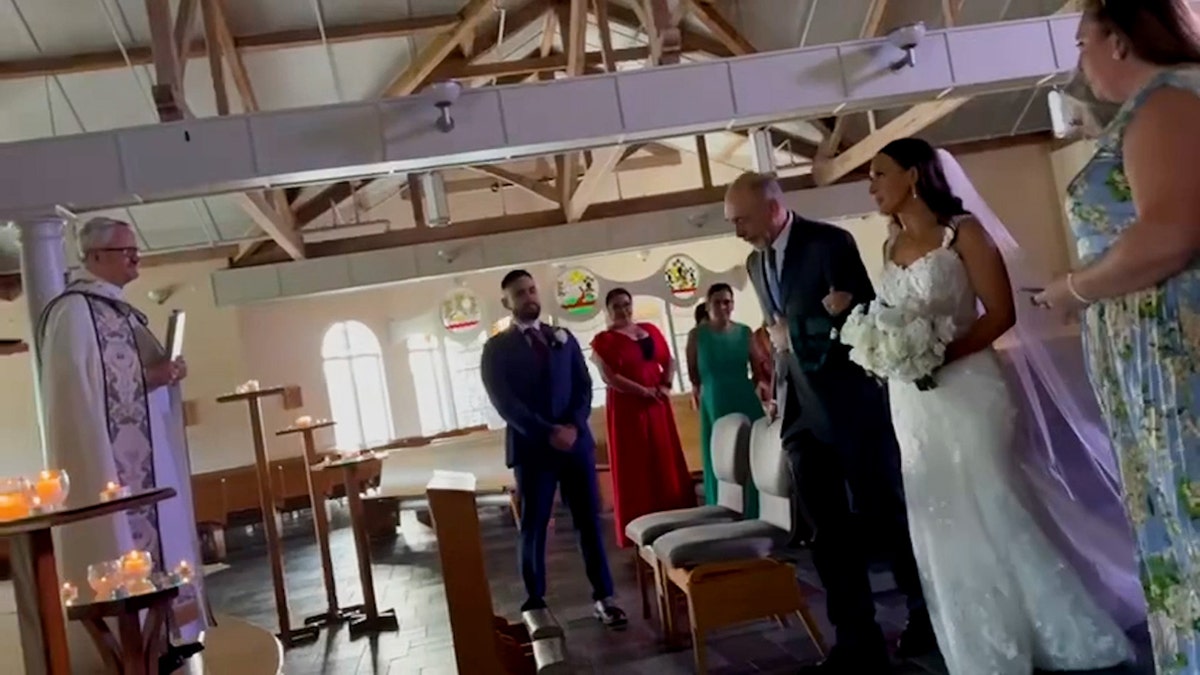 David Jones walks daughter Elizabeth down the aisle