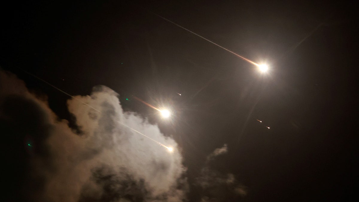 Missiles fly in the sky amid cross-border hostilities between Hezbollah and Israel