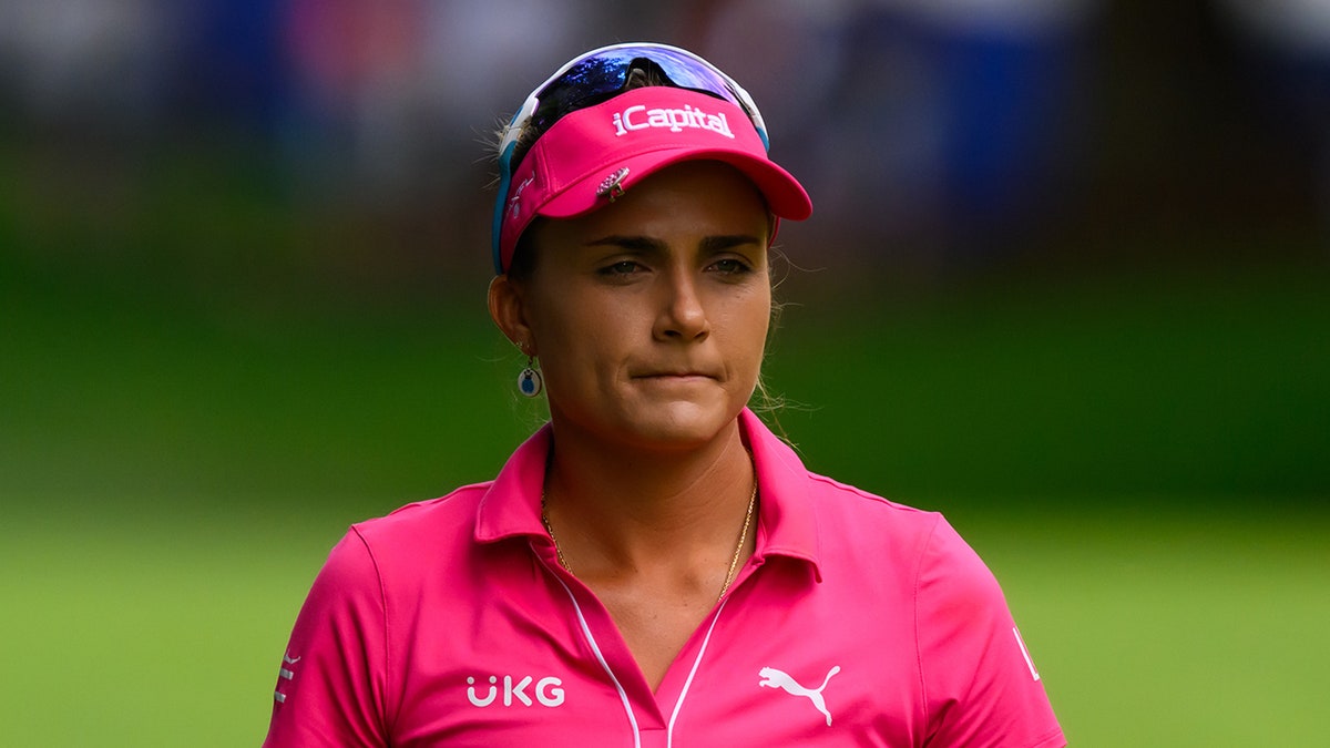 Lexi Thompson walks on golf course