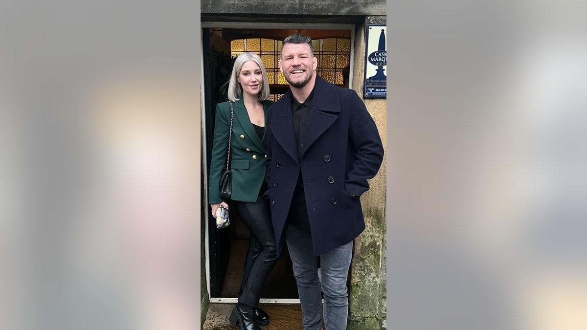 UFC champion   Michael Bisping poses alongside his wife, Rebecca