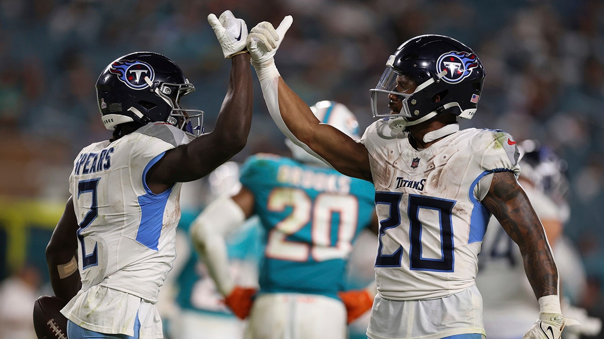 Tyjae Spears and Tony Pollard celebrate