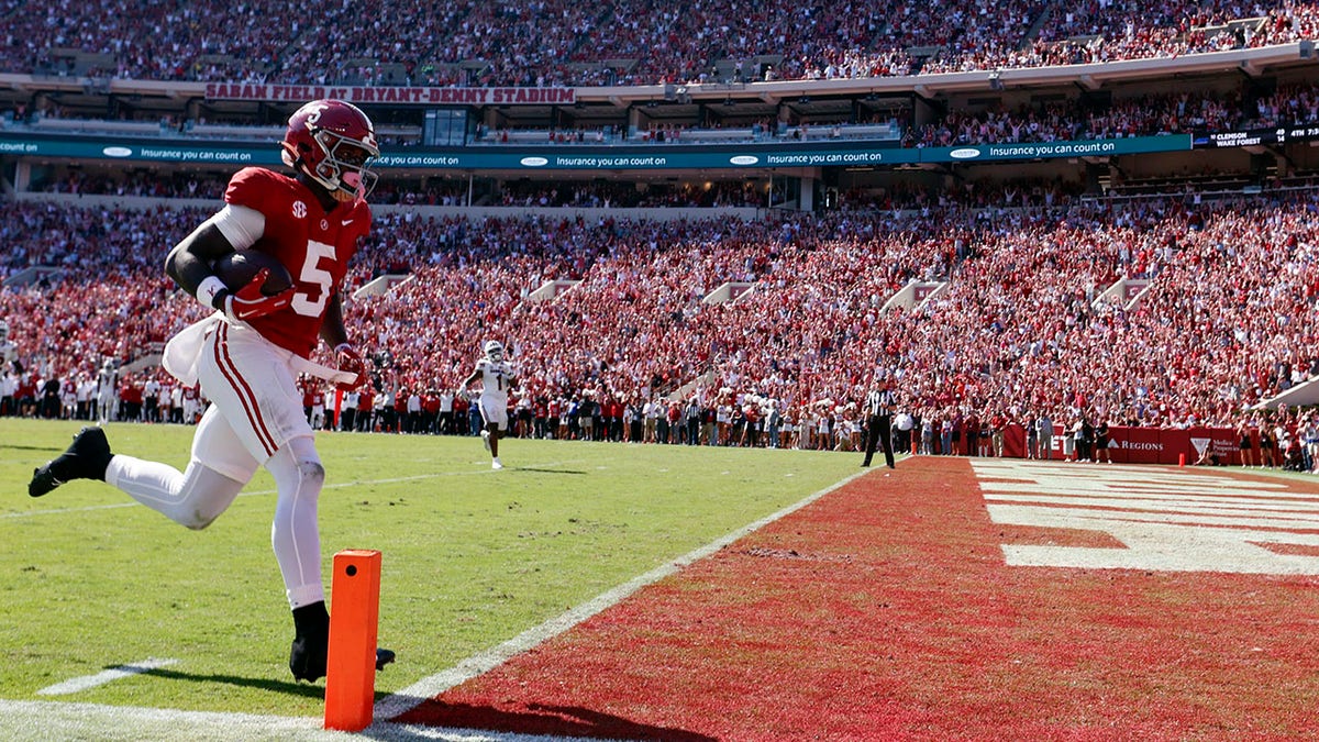 The Alabama Crimson Tide wide receiver scores a touchdown