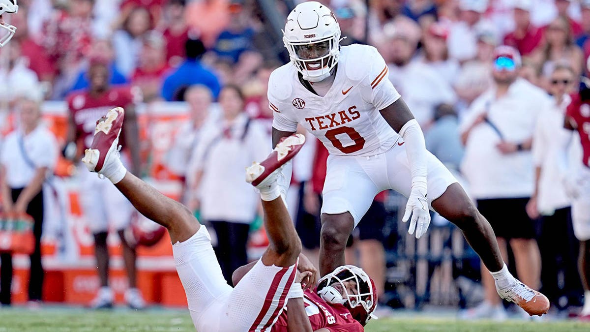 Texas football stars plant flag through Baker Mayfield jersey after win