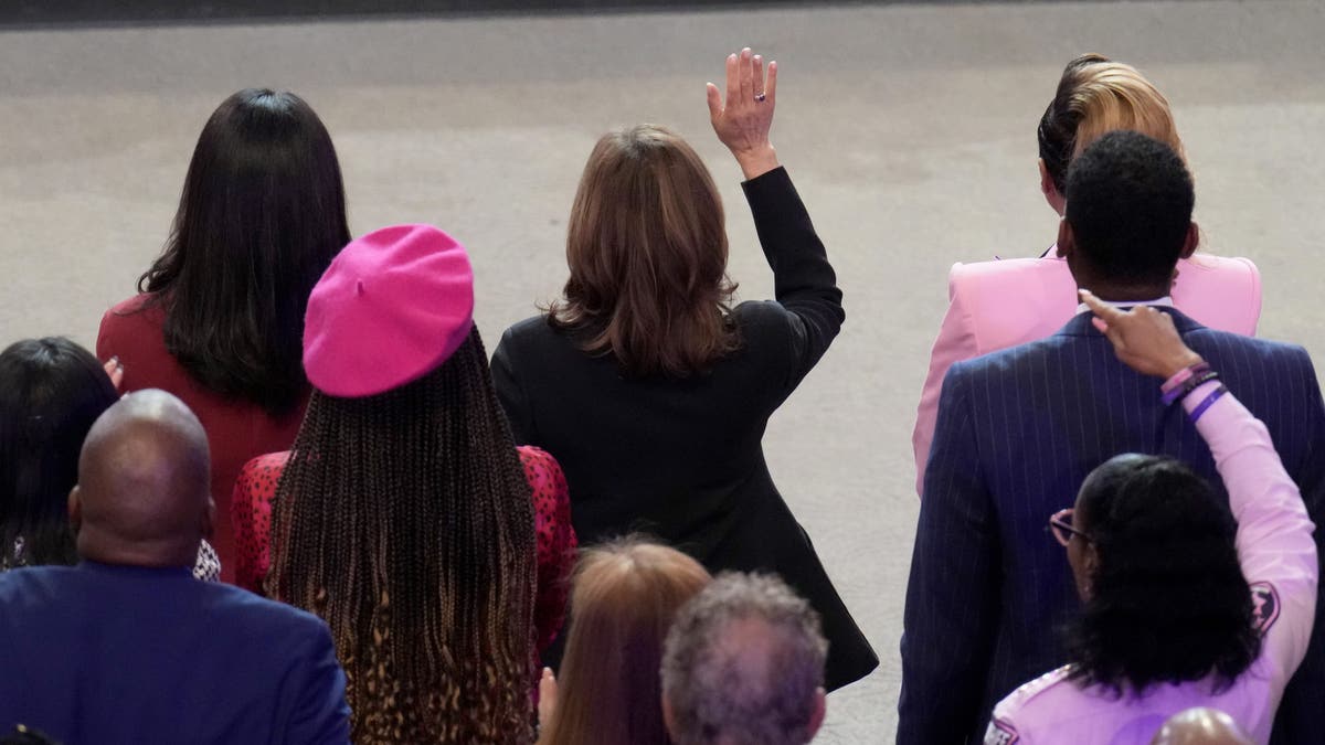 Democratic presidential nominee Vice President Kamala Harris, top center, attends a church service at New Birth Baptist Church in Stonecrest, Georgia, on Sunday, Oct. 20, 2024.