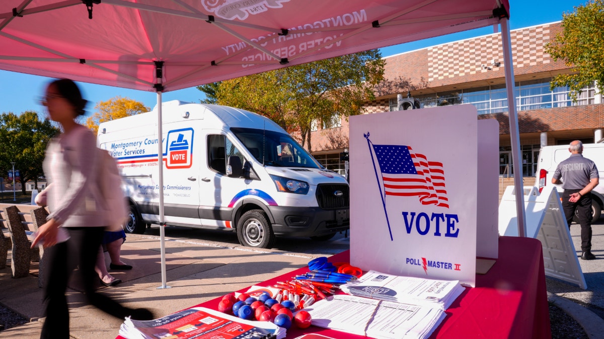 A idiosyncratic   walks past   Montgomery Countys elector  services van successful  King of Prussia, Pa., Tuesday, Oct. 22, 2024. (AP Photo/Matt Rourke)