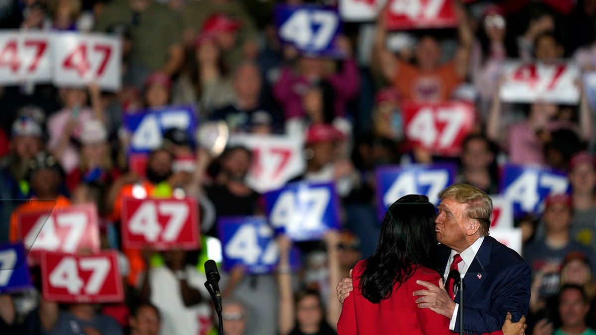 Trump kisses Gabbard during the meeting