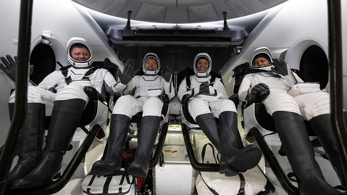 astronauts in the capsule before splashdown