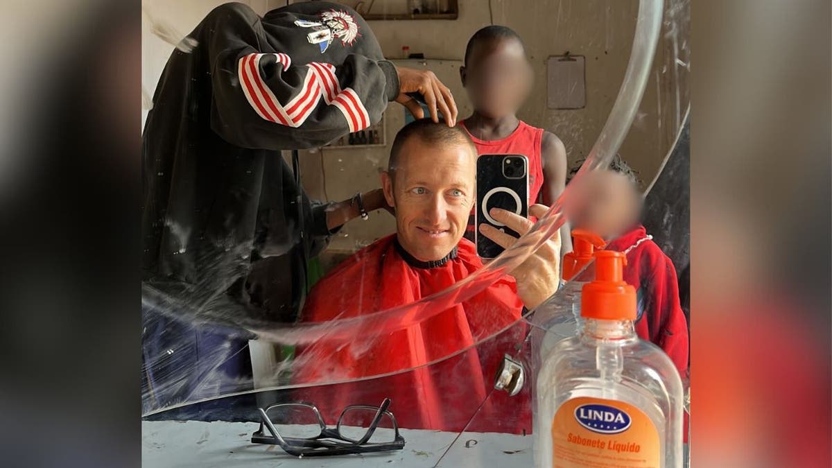 Pastor Beau Shroyer getting a haircut successful Africa recently