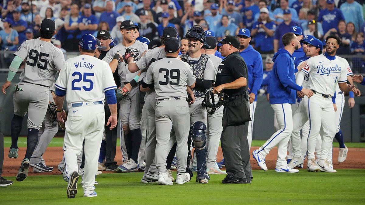 Benches wide   betwixt  Yankees and Royals