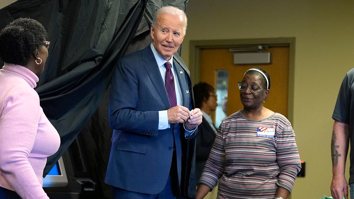 Biden leaving the voting booth