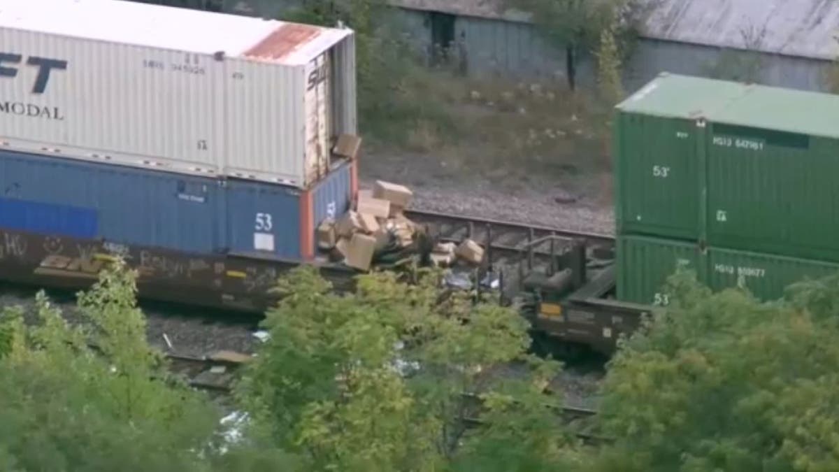 Boxes spill retired  from a freight train