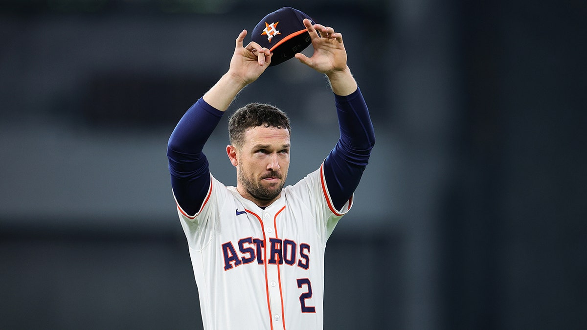 Alex Bregman waves to the fans