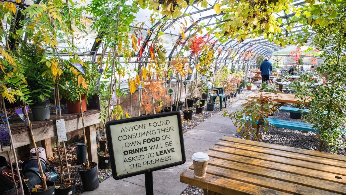 signs about behavior at garden cafe