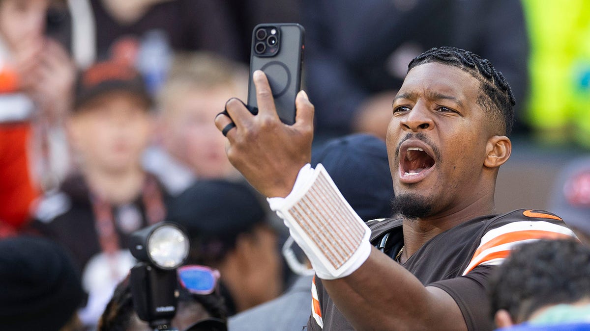 October 27, 2024; Cleveland, Ohio, United States; Cleveland Browns quarterback Jameis Winston (5) takes a selfie after defeating the Baltimore Ravens at Huntington Bank Field. Mandatory Credit: Scott Galvin-Imagn Images