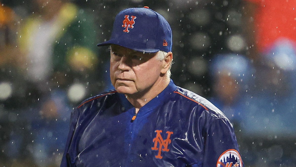 Buck Showalter looks on