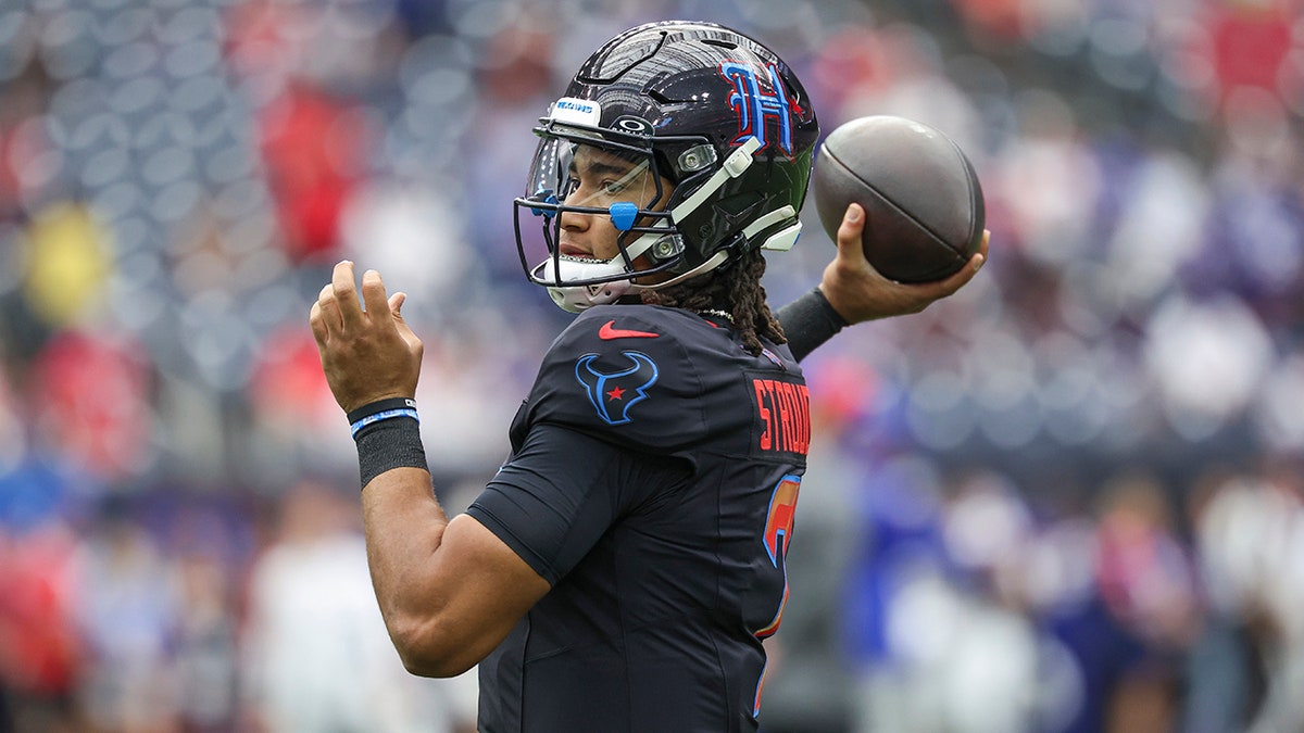 CJ Stroud throws a pass