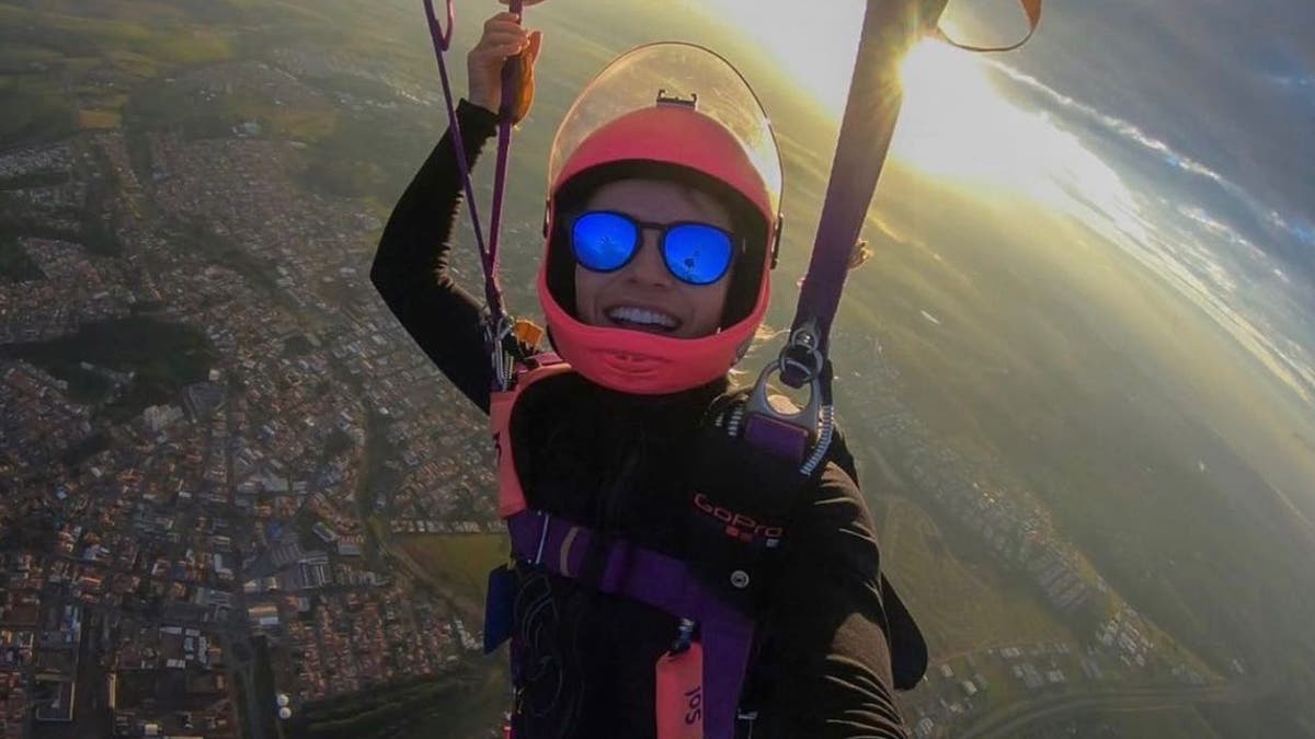 Skydiver Carolina Muñoz Kennedy takes a selfie during a dive