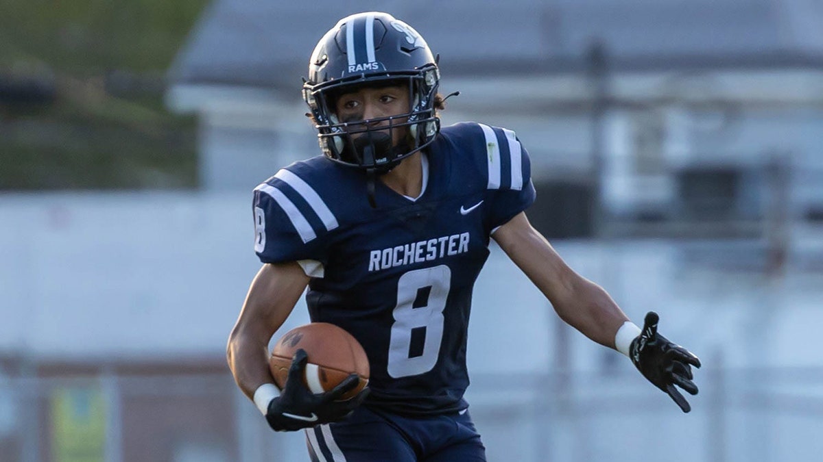 Rochester High School moving  backmost  during a shot   game