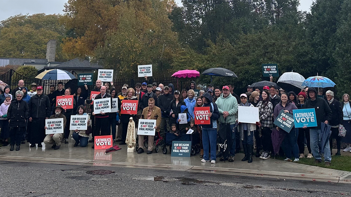 Catholics rally in front of the governor's house. Whitmer