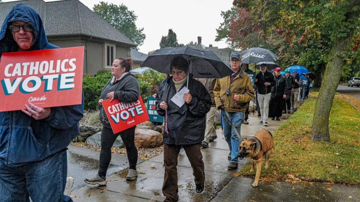 Catholics rally in front of the governor's house. Whitmer