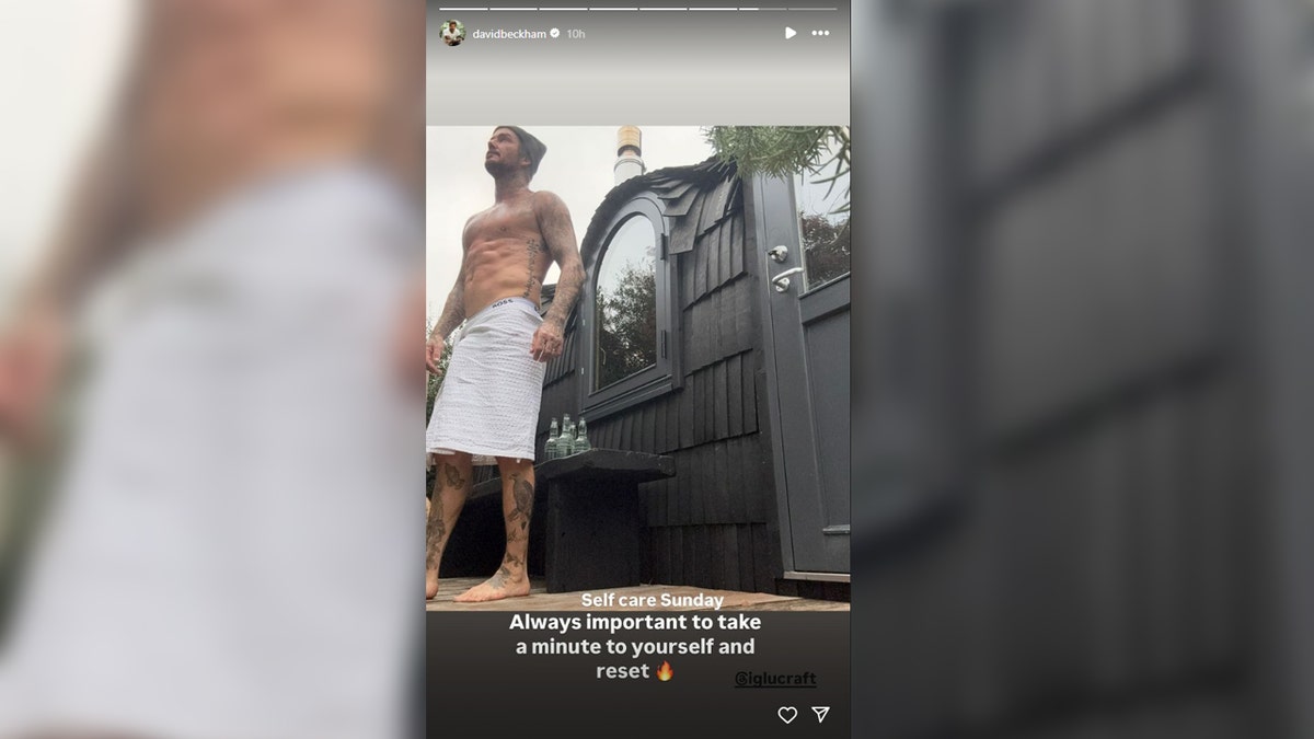 David Beckham flashes his abs successful  a shirtless selfie.