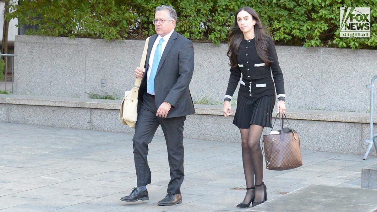 Marc Agnifilo and Tenny Geragos carry briefcases to Sean Diddy Combs' court hearing