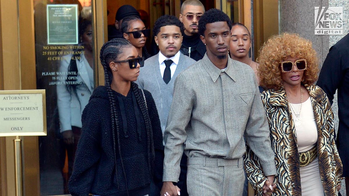 Janice Combs and Diddy's sons leave court holding hands