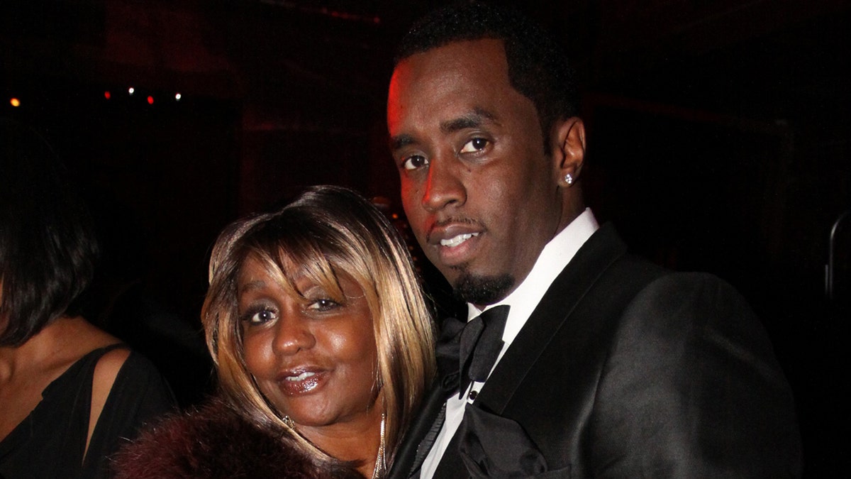 Sean Diddy Combs smiles adjacent  to his mother, Janice Combs.