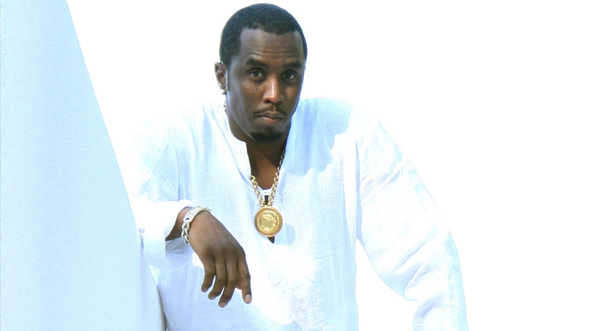 Diddy looks superior   connected  the balcony astatine  his infamous achromatic  party