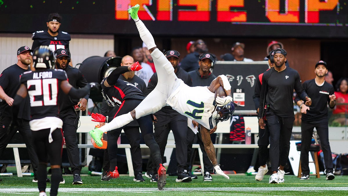 DK Metcalf tumbles down