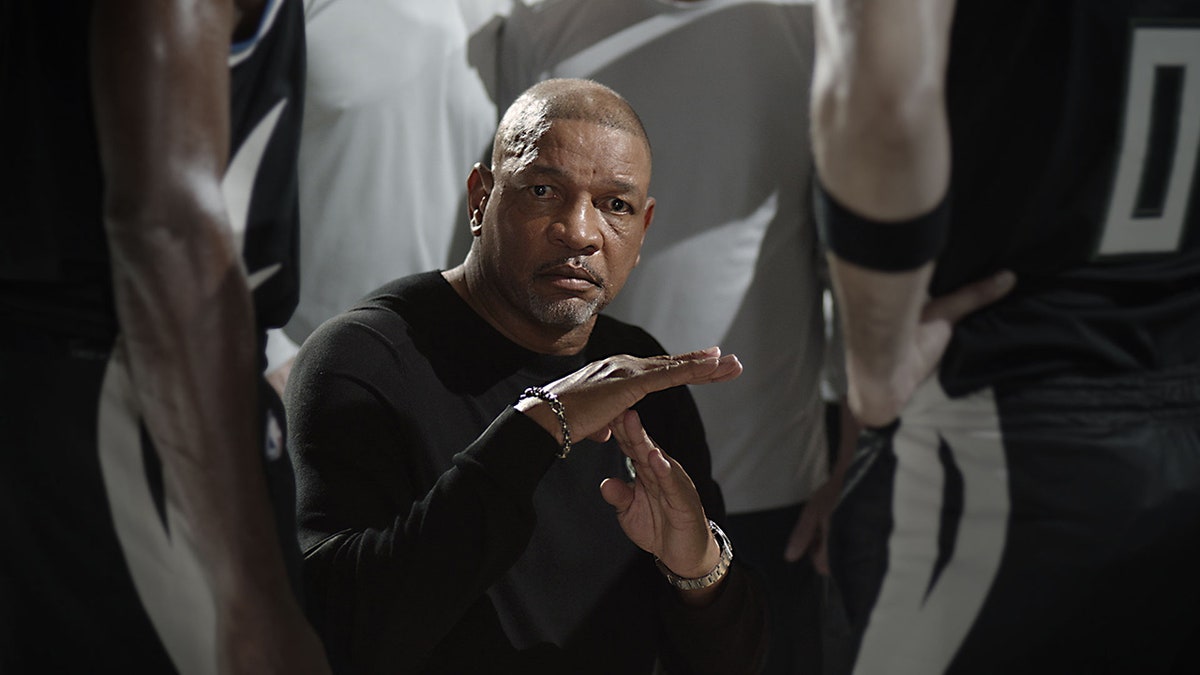 Doc Rivers signals for a timeout with his hand