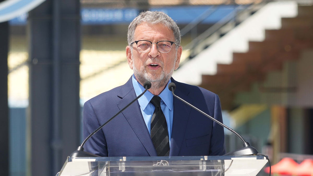 Charley Steiner speaks during a ceremonial  