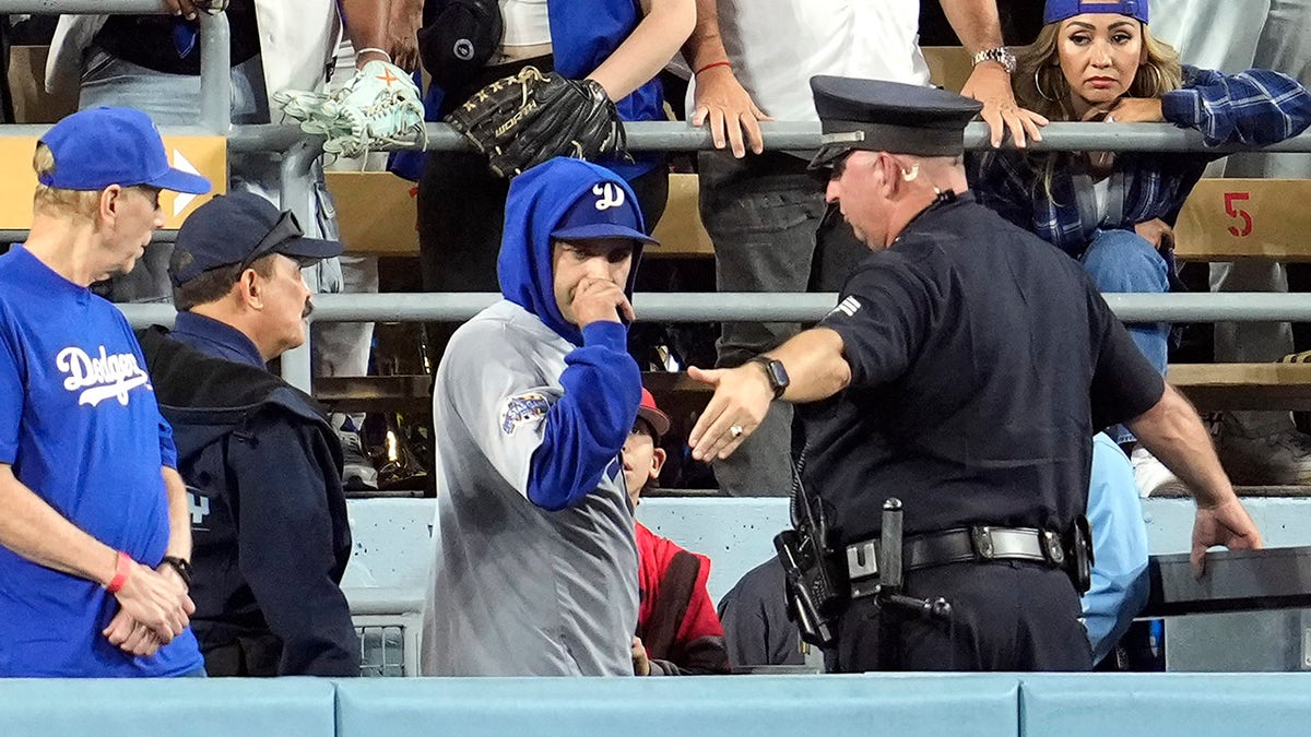 Dodger fan and police officer.