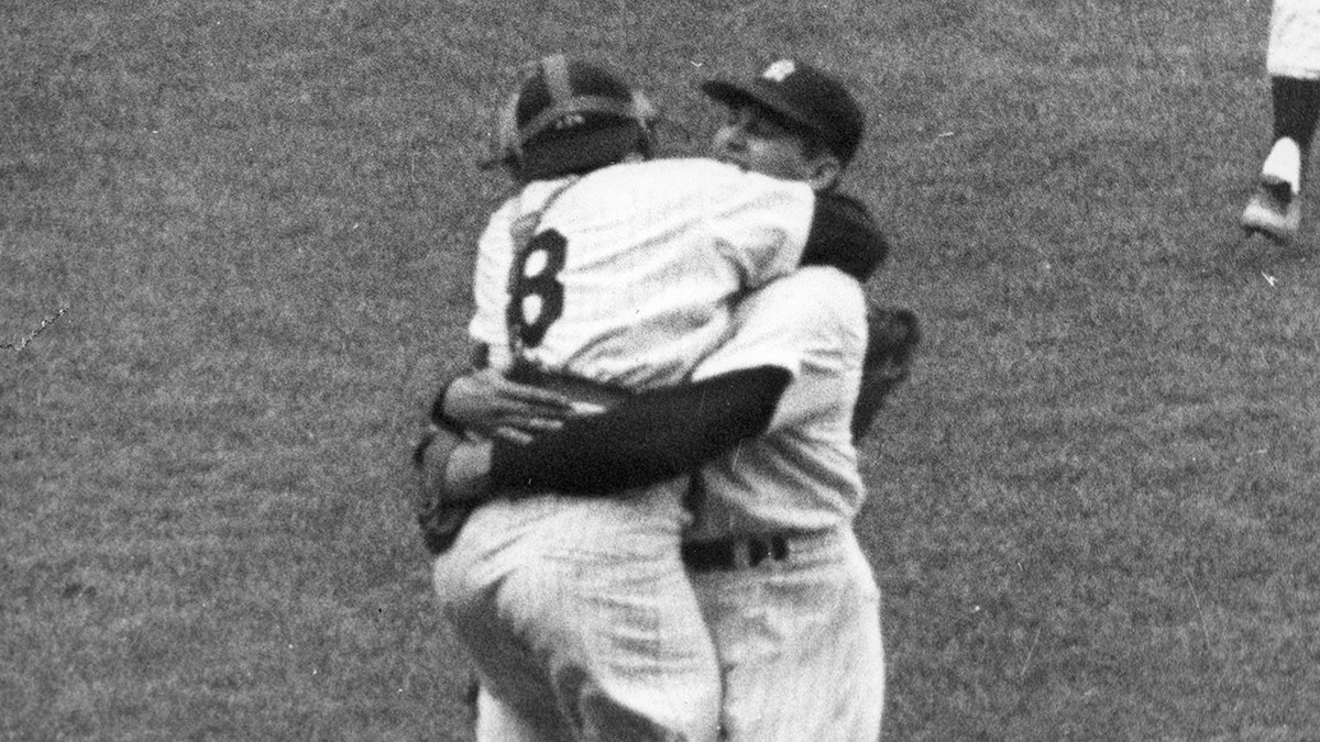 Don Larsen hugs Yogi Berra after perfect game