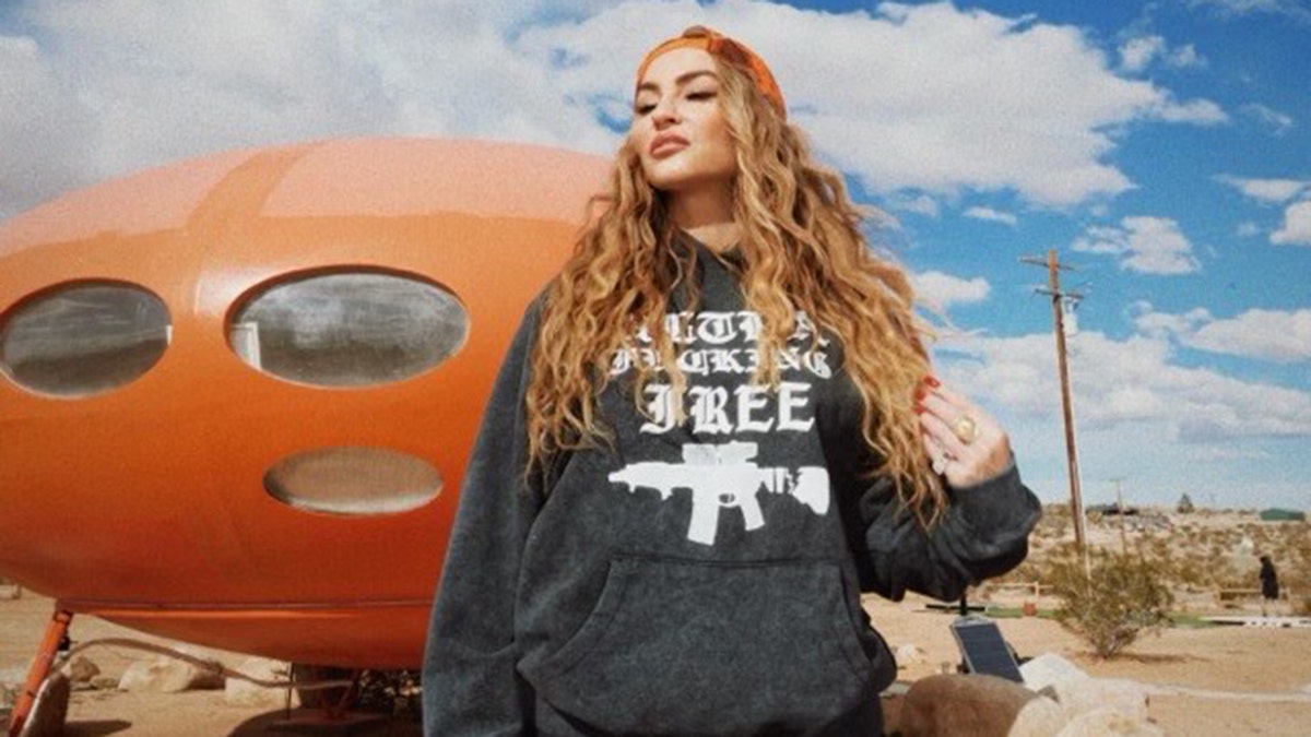 Drea de Matteo posing in ULTRAFREE sweatshirt