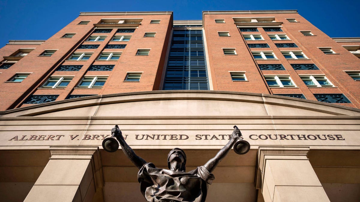 federal courthouse beforehand   with Justice statue