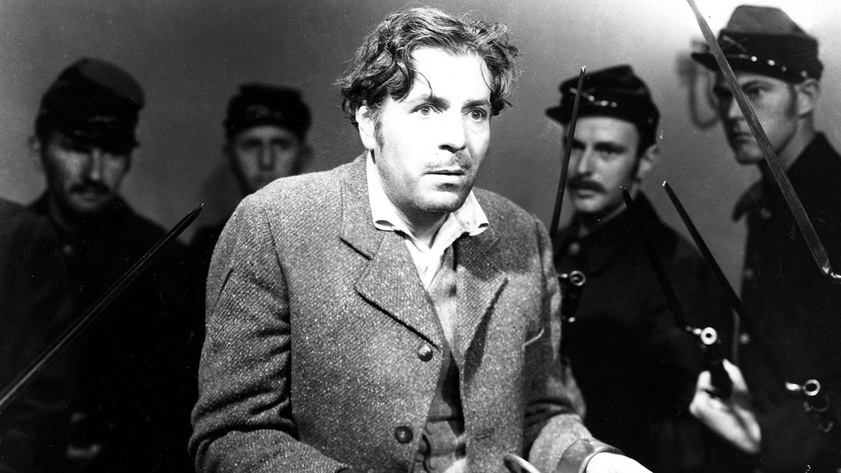 A close-up of Warner Baxter looking distraught.