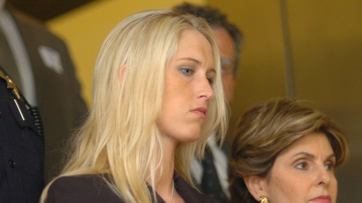 Amber Frey leaves the courthouse with her attorney Gloria Allred after a day of testifying during the double murder trial of Scott Peterson on Tuesday, August 10, 2004 at the San Mateo County Superior Courthouse in Redwood City. 