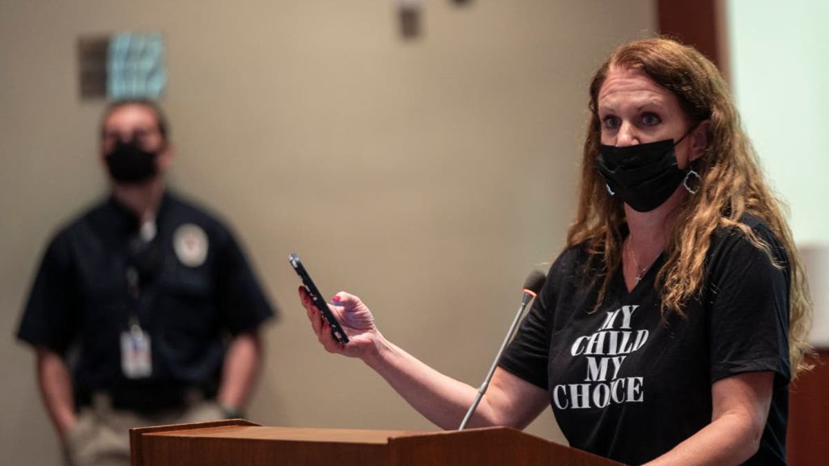 parent testifying astatine  schoolhouse  committee  successful  2021 wearing mask