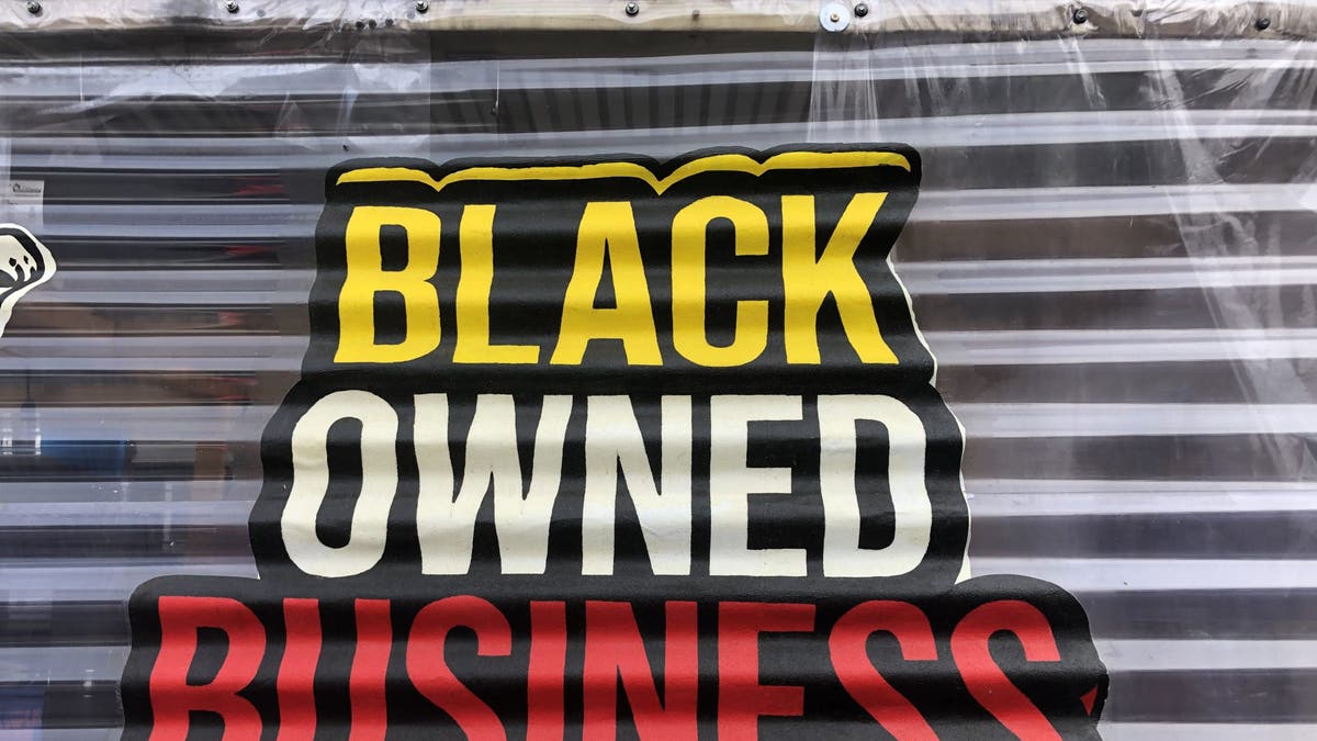 Black Owned Business, sign outside restaurant, Queens, New York.