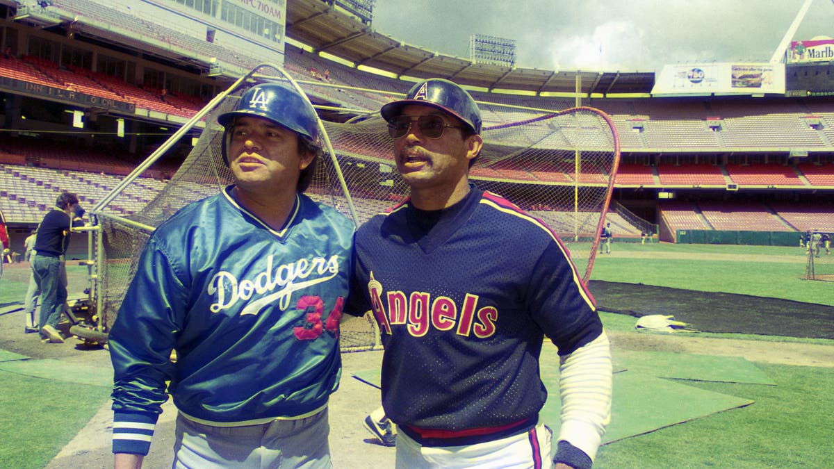 Reggie Jackson, right, and Fernando Valenzuela pregame before game of Los Angeles Dodgers and California Angels on April 6, 1986 in Anaheim, California.